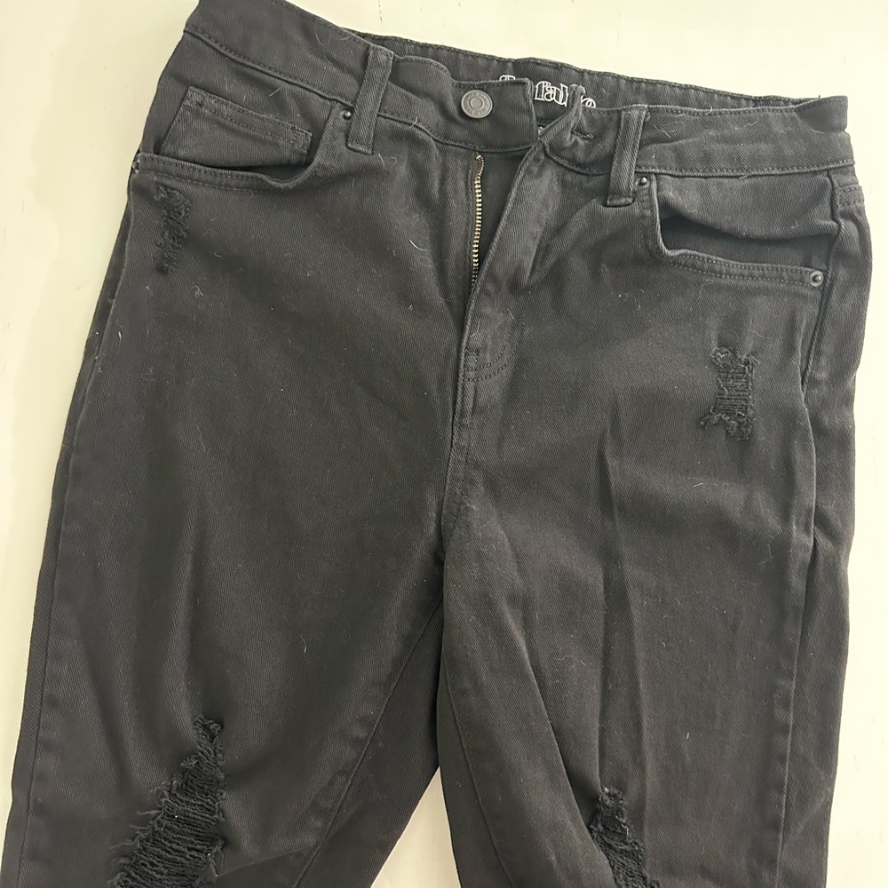 Women’s Black knee length cutoff shorts. Size 4.
